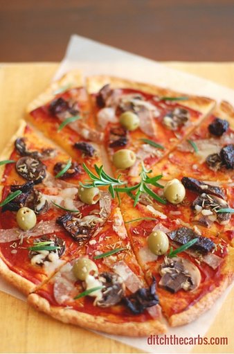 You have seriously got to try the best and easiest recipe for low carb pizza out there - FatHead pizza. It's low carb, wheat free, gluten free and the easiest recipe you'll find. Googles top low carb pizza. #lowcarb #wheatfree #sugarfree #glutenfree | ditchthecarbs.com