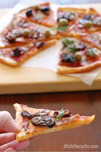 You have seriously got to try the best and easiest recipe for low carb pizza out there - FatHead pizza. It's low carb, wheat free, gluten free and the easiest recipe you'll find. Googles top low carb pizza. #lowcarb #wheatfree #sugarfree #glutenfree | ditchthecarbs.com