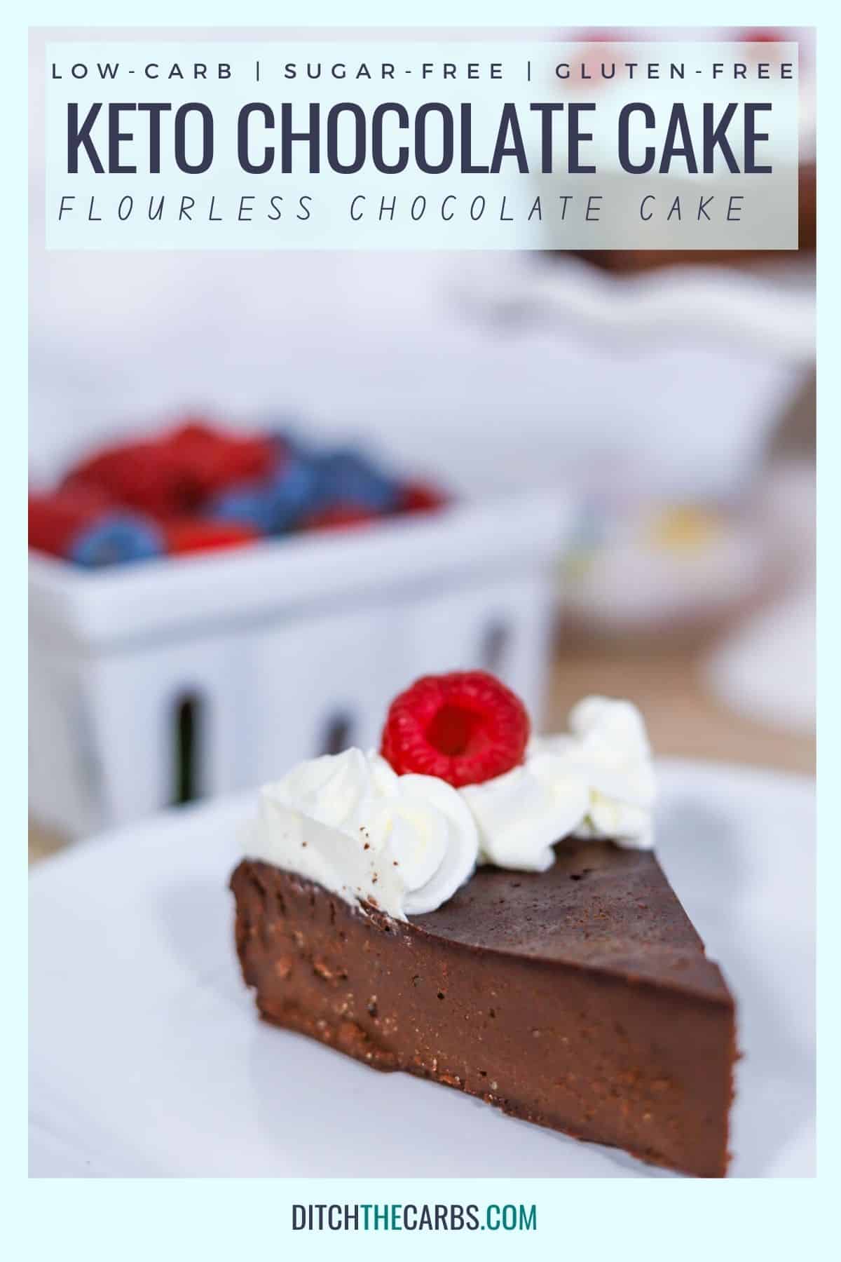 keto chocolate cake decorated with whipped cream and berries sliced on a white plate