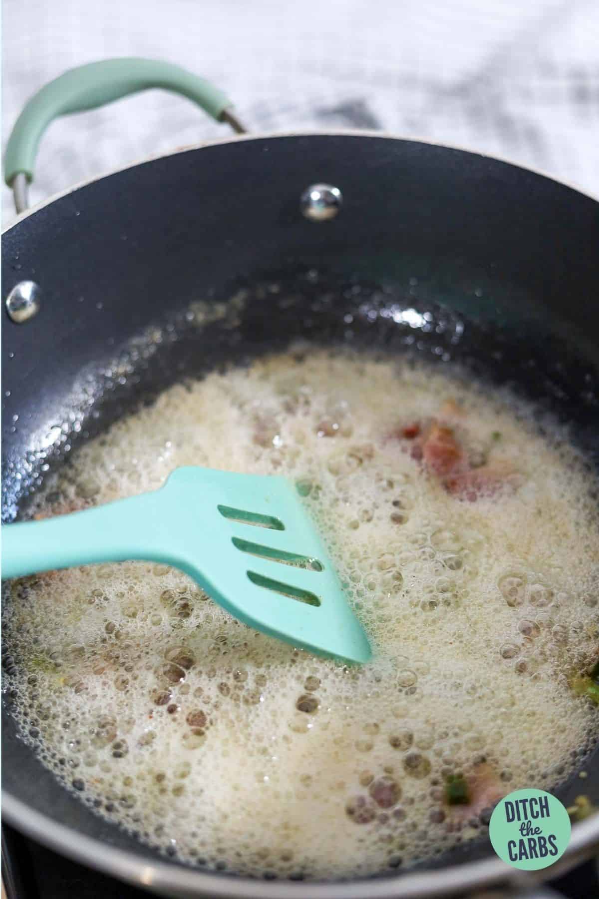 bacon frying in a pan