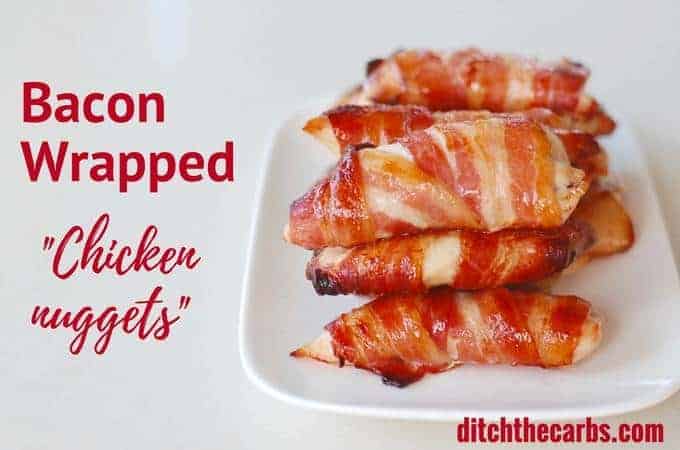 Bacon covered chicken nuggets on a white rectangle plate