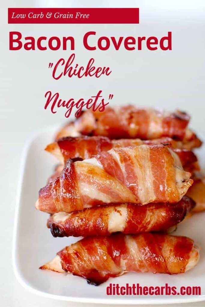 Bacon covered chicken nuggets on a white serving platter