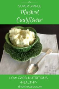 Mashed cauliflower in an antique cabbage bowl with a silver spoon