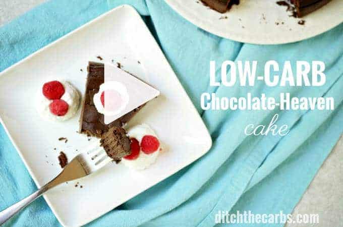 low-carb chocolate-heaven cake served with whipped cream and berries