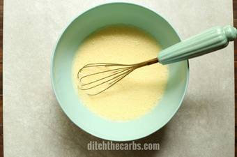 Mixing eggs and heavy cream together with a whisk