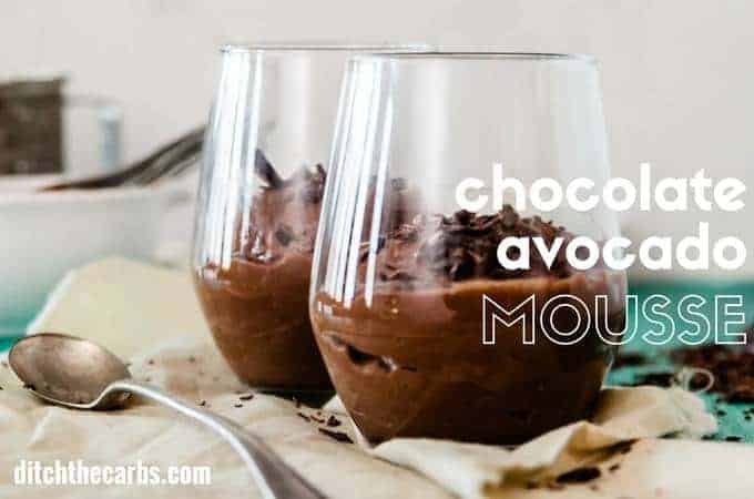 sugar-free chocolate avocado mousse serving suggestion showing 2 glasses decorated with chocolate