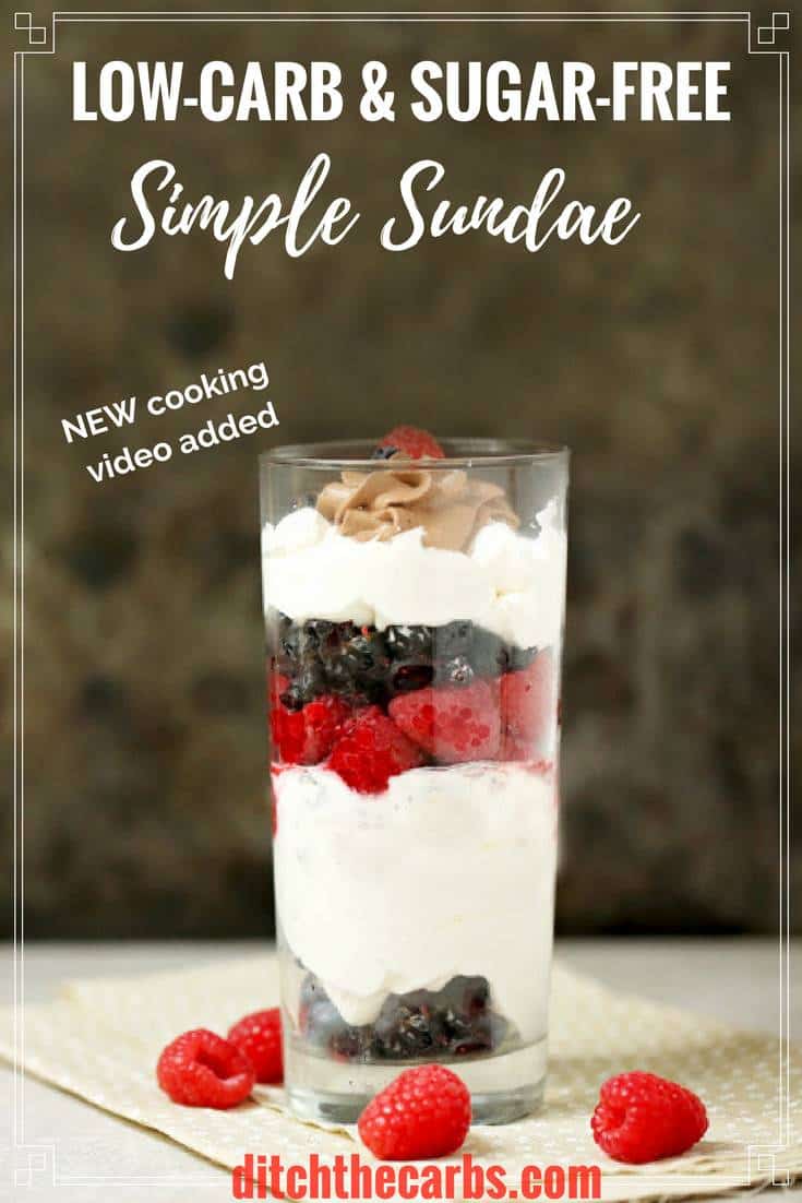 Simple low carb sundae with berries and whipped cream served in a tall glass and napkin