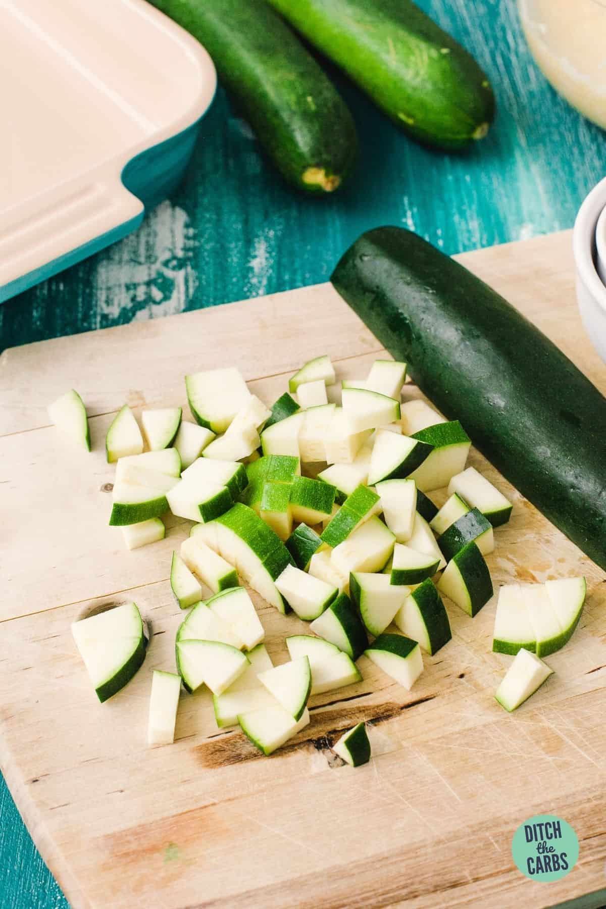 chopped zucchini on a wooden board