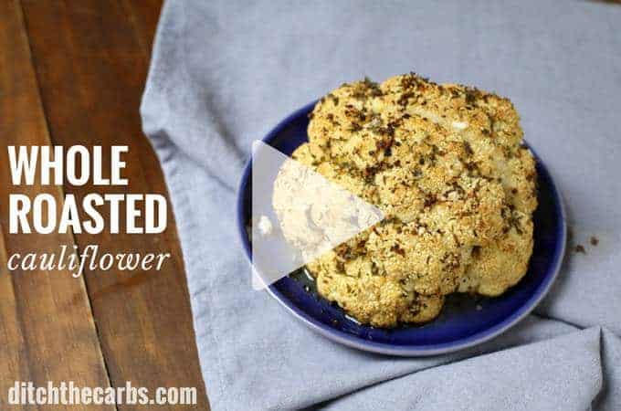 A whole roasted cauliflower brushed with butter and herbs