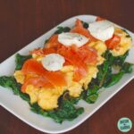 scrambled eggs on a bed of spinach