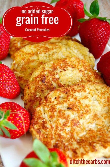 Low carb coconut pancakes served with fresh strawberries