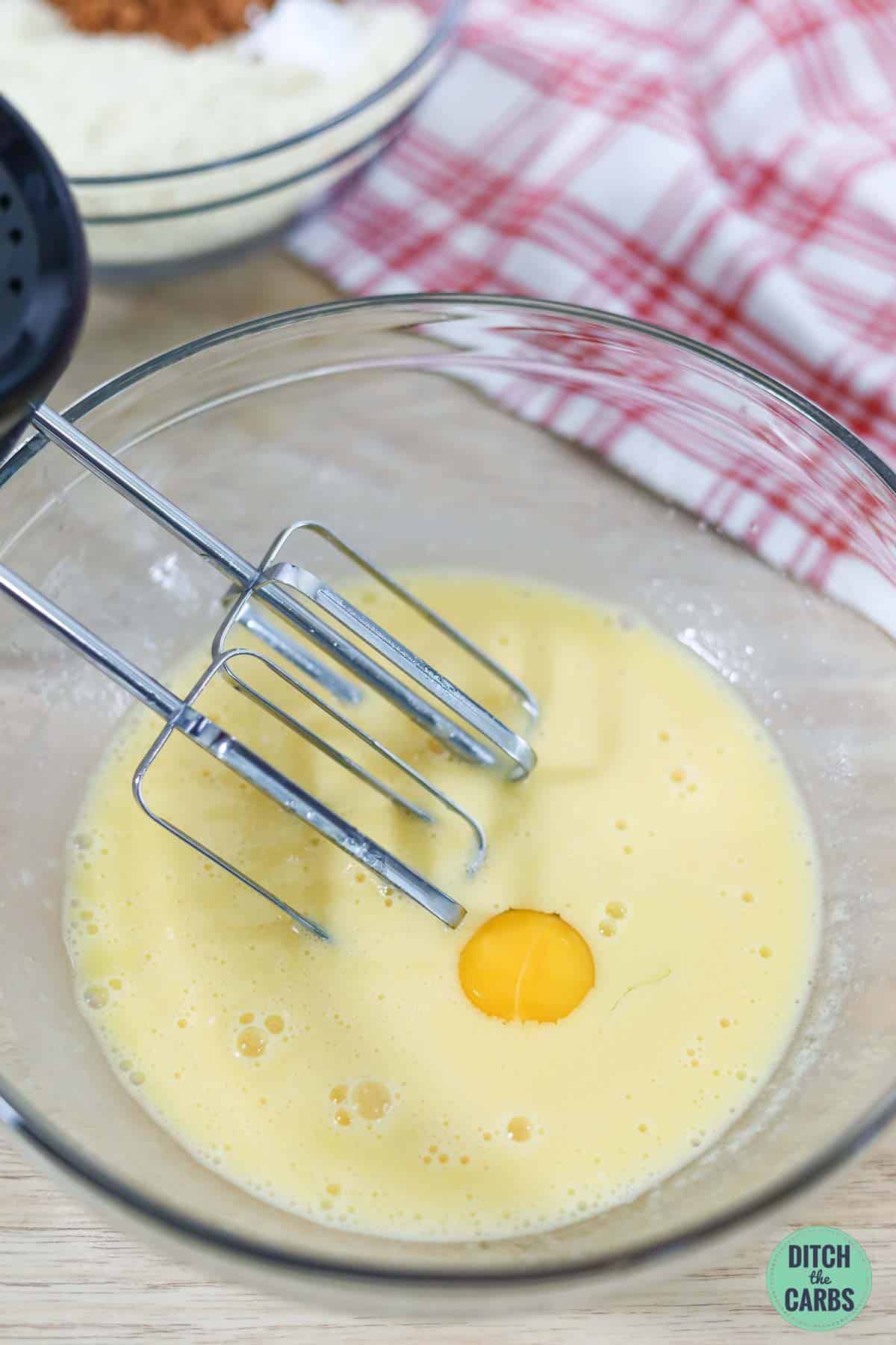 a glass bowl with eggs and butter