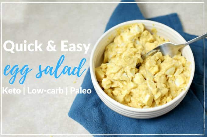 Quick and easy recipe for low-carb egg salad served in a white bowl on a blue napkin