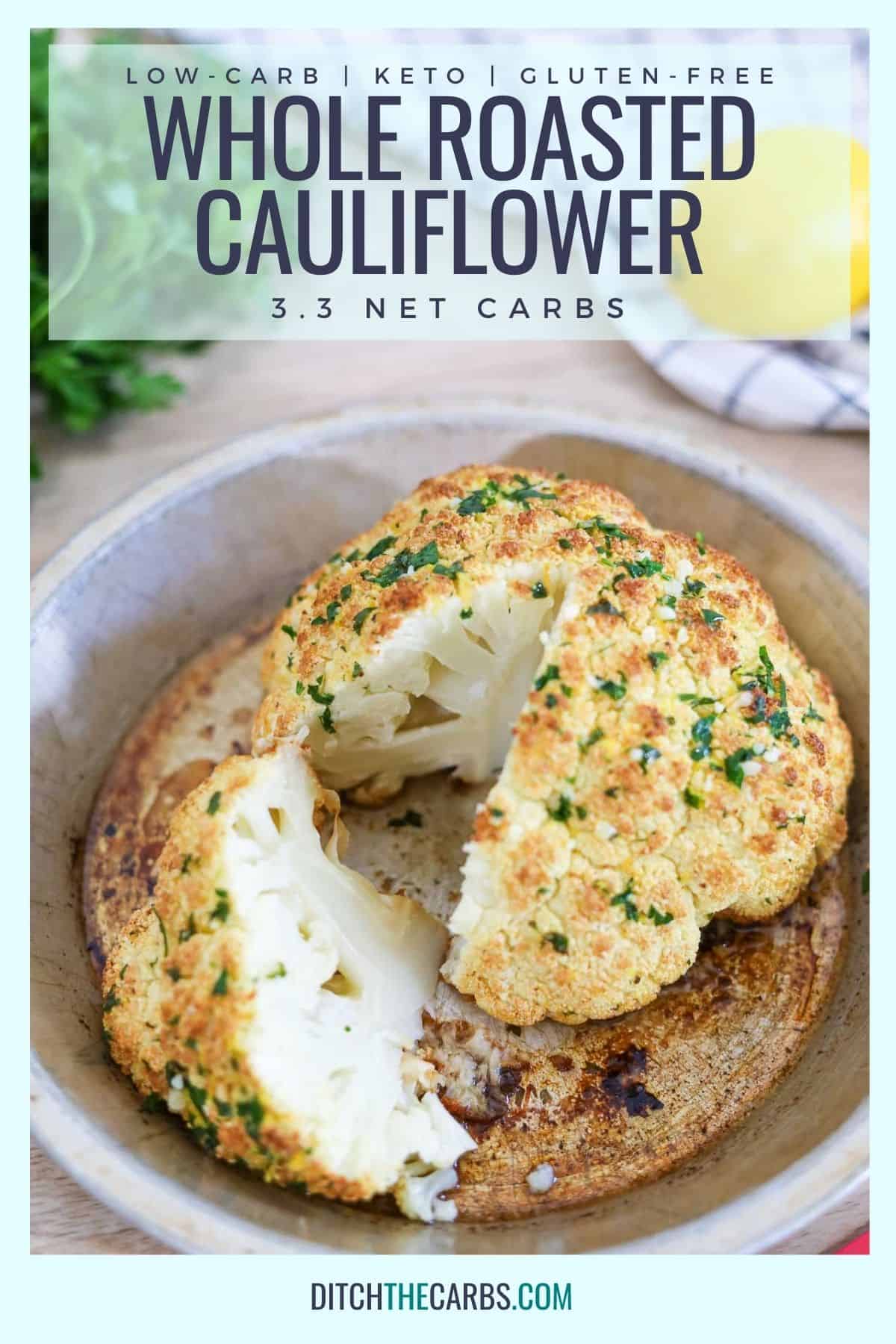 sliced whole roasted cauliflower on a white plate with herbs