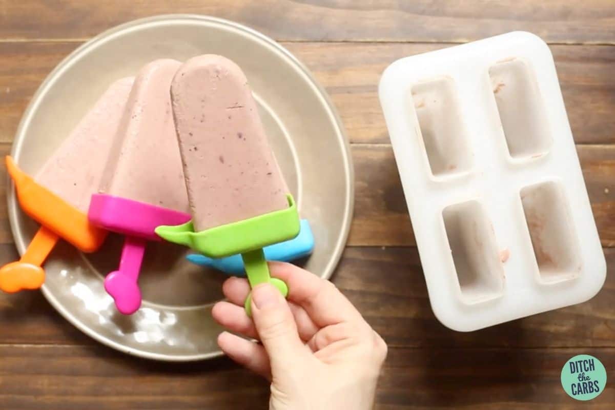 removing popsicles from their molds once frozen