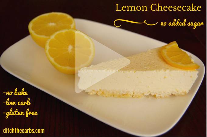 A slice of lemon cheesecake with fresh lemons