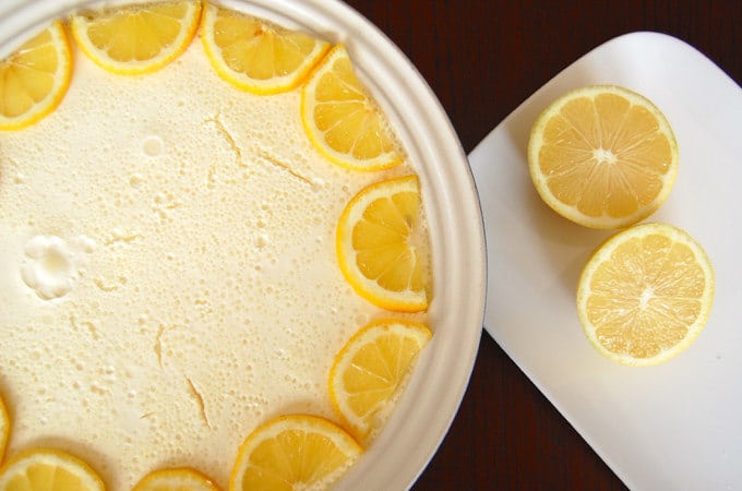 no-bake lemon cheesecake with slices of lemon