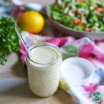 easy keto salad dressing about to be drizzled on a healthy salad
