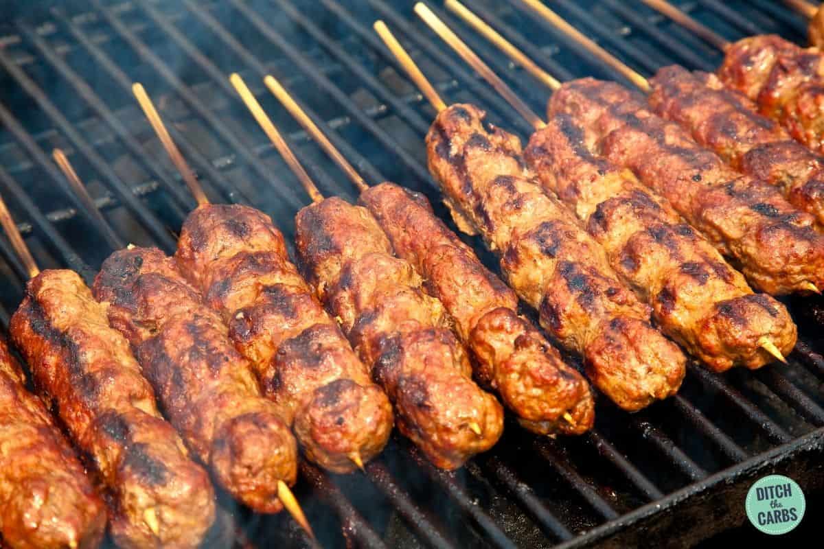 keto lamb kebabs cooking on the BBQ grill