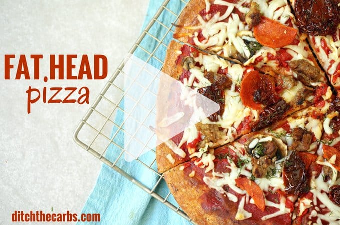 Fat head pizza sliced sitting on a wire cooling rack
