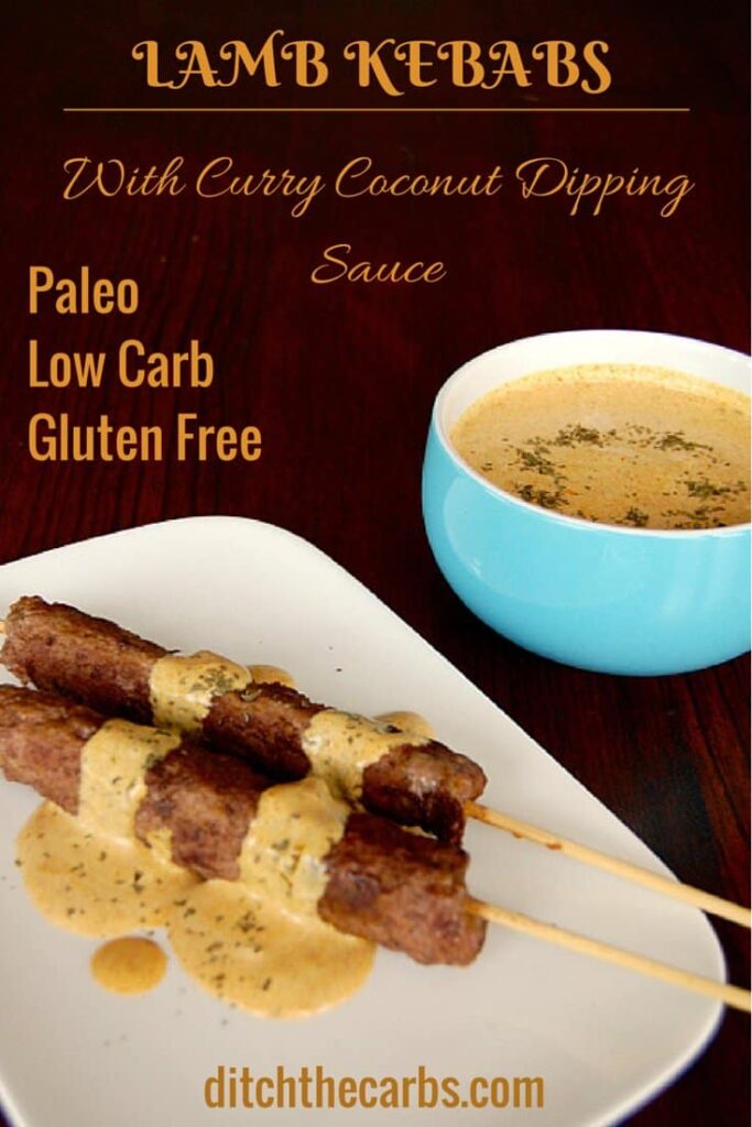 Lamb kebabs served with a coconut curry dipping sauce in a blue bowl