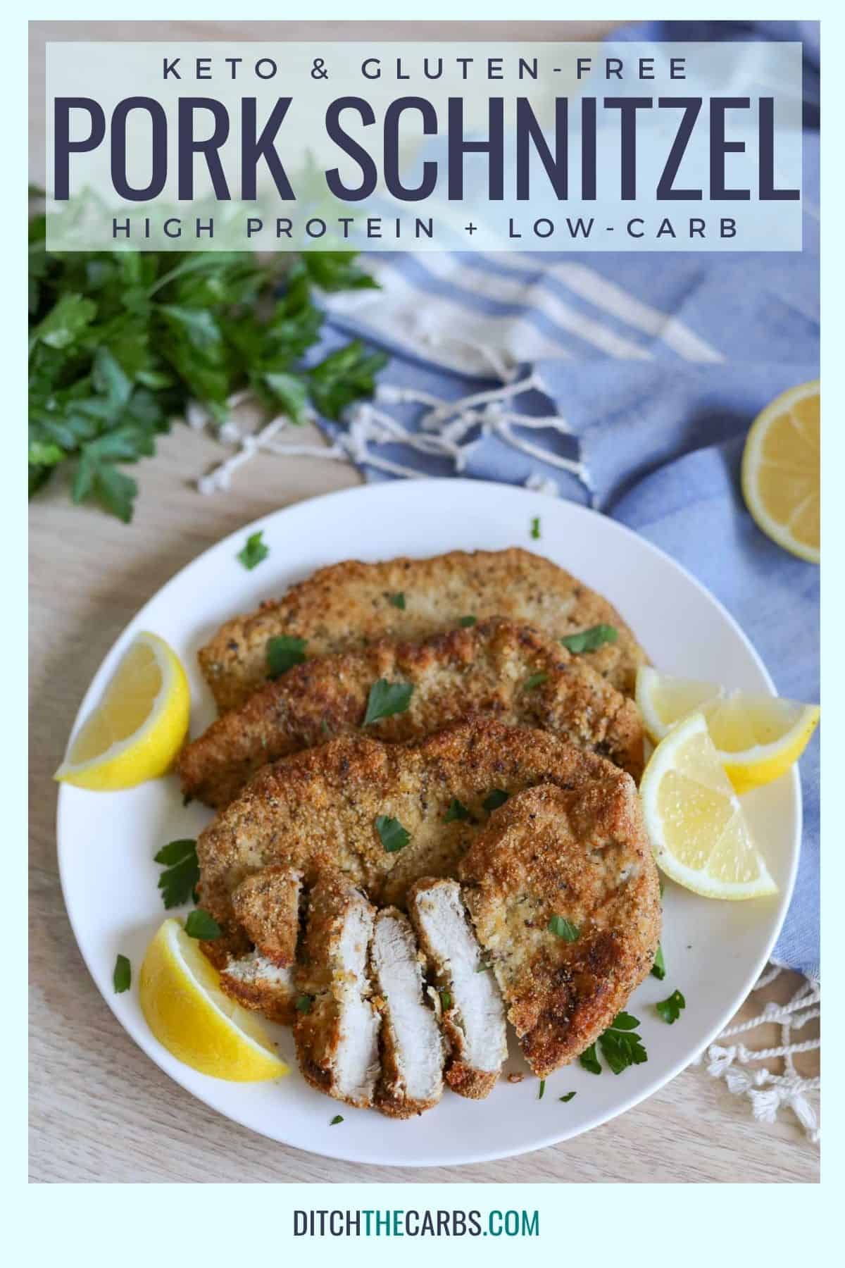 keto pork schnitzel recipe cooked and served with wedges of fresh lemons