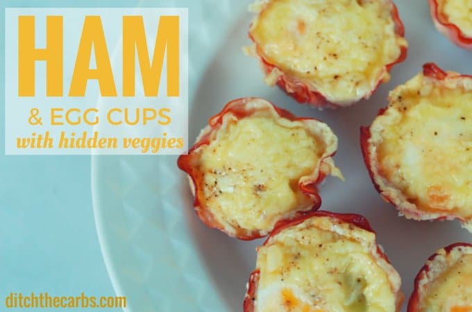 Ham and egg cups served on a decorative white plate