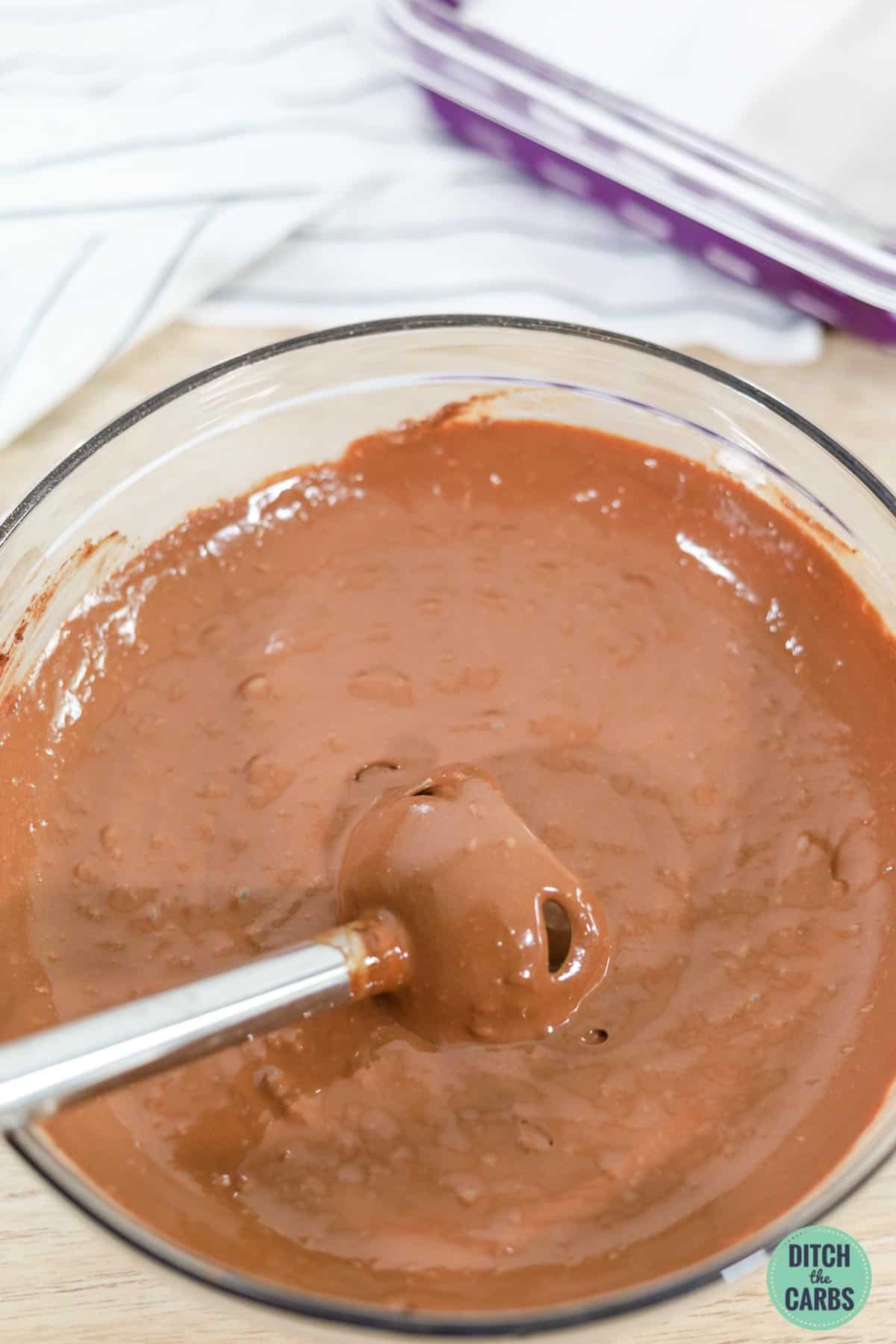 a stick blender with brownie batter