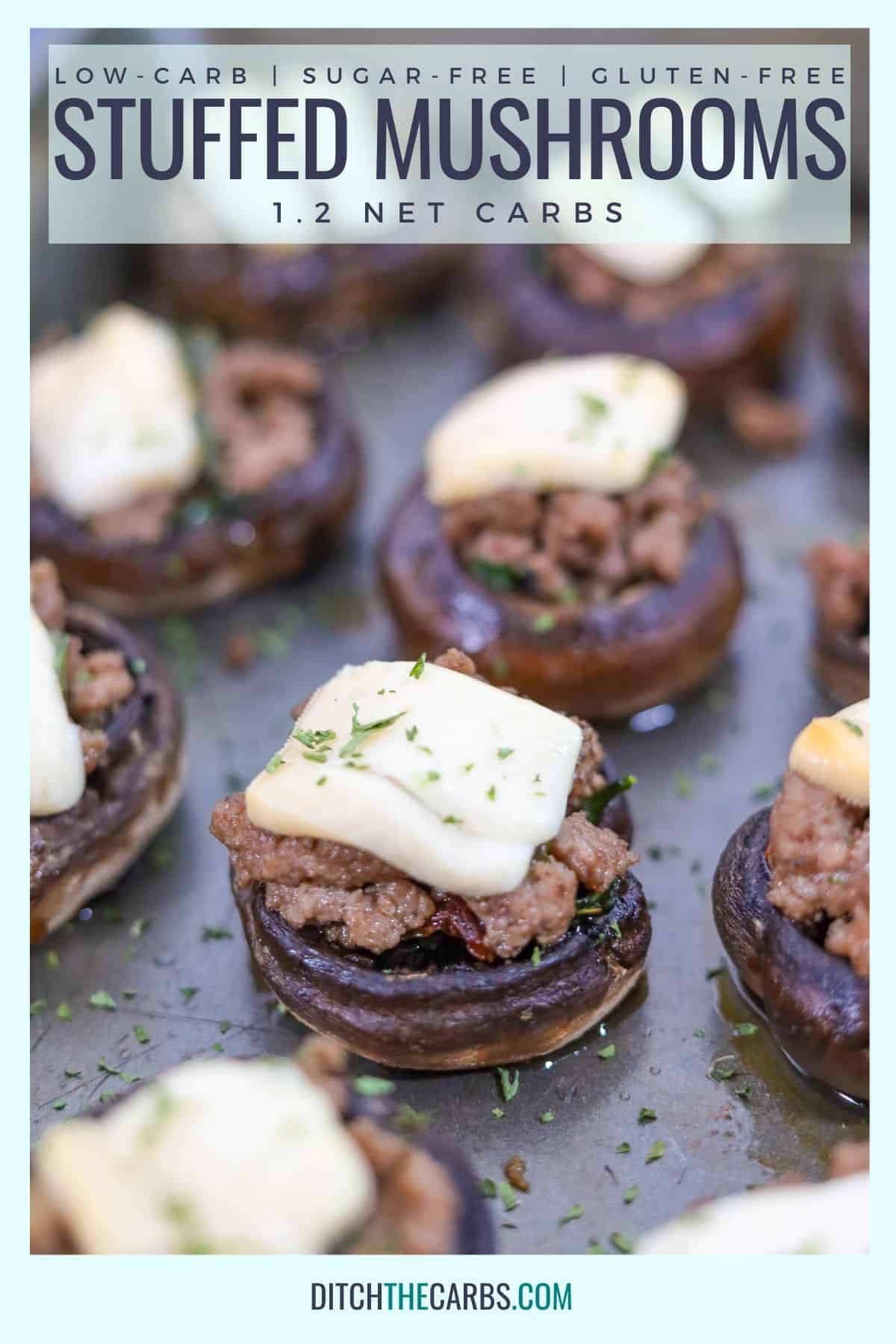 baked cheesy keto stuffed mushrooms on a baking tray