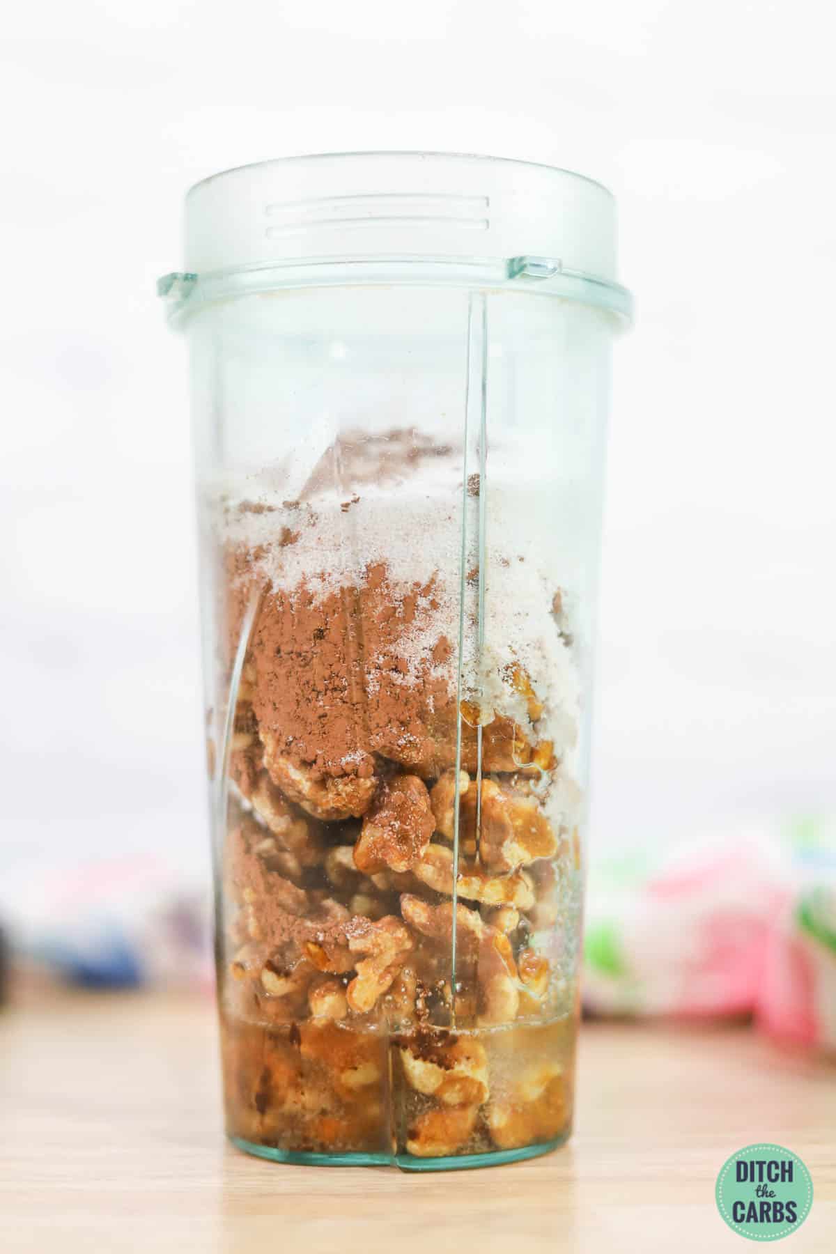 walnuts and cocoa in a Ninja blender jar
