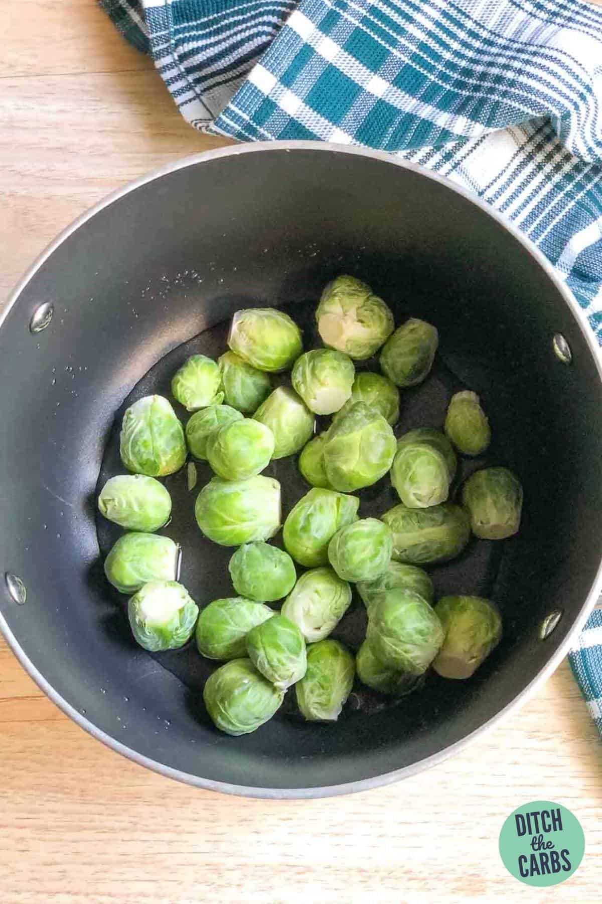 Brussels sprouts cooking in a saucepan