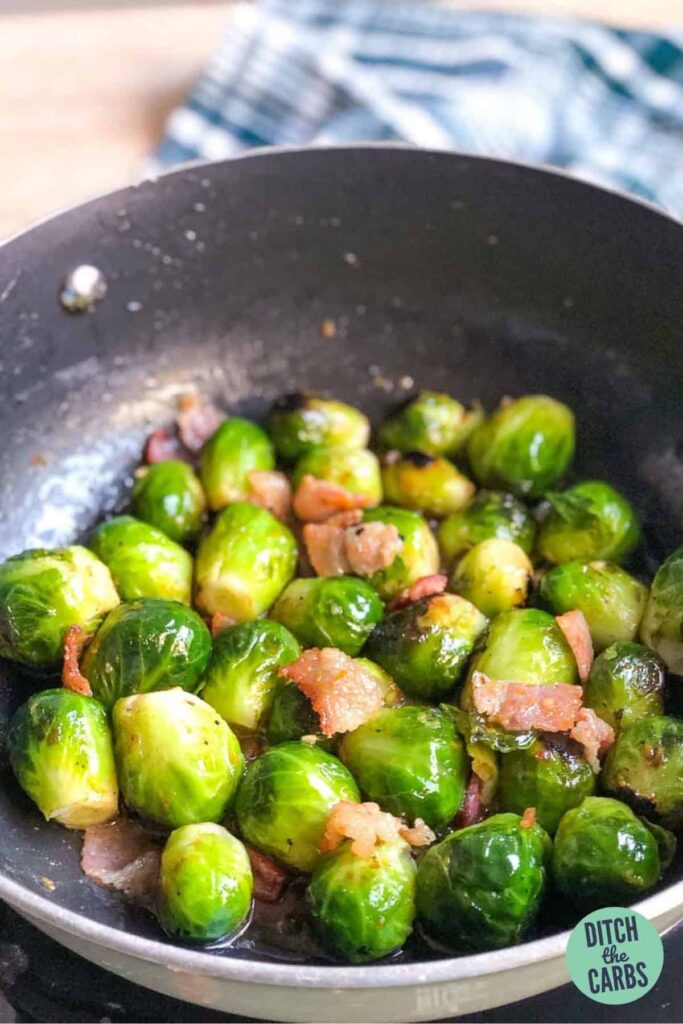 Brussels sprouts in a frying pan with bacon
