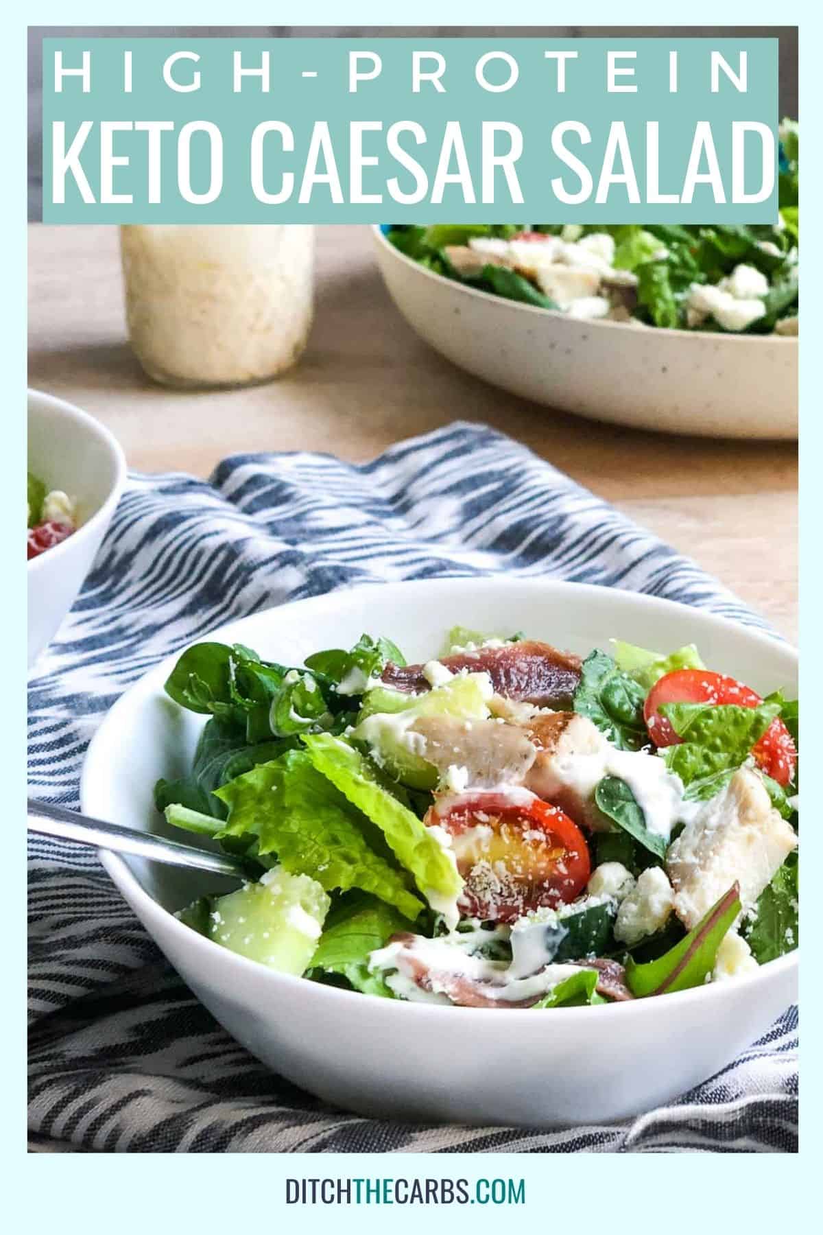 keto Caesar salad in a white bowl on a blue and white cloth
