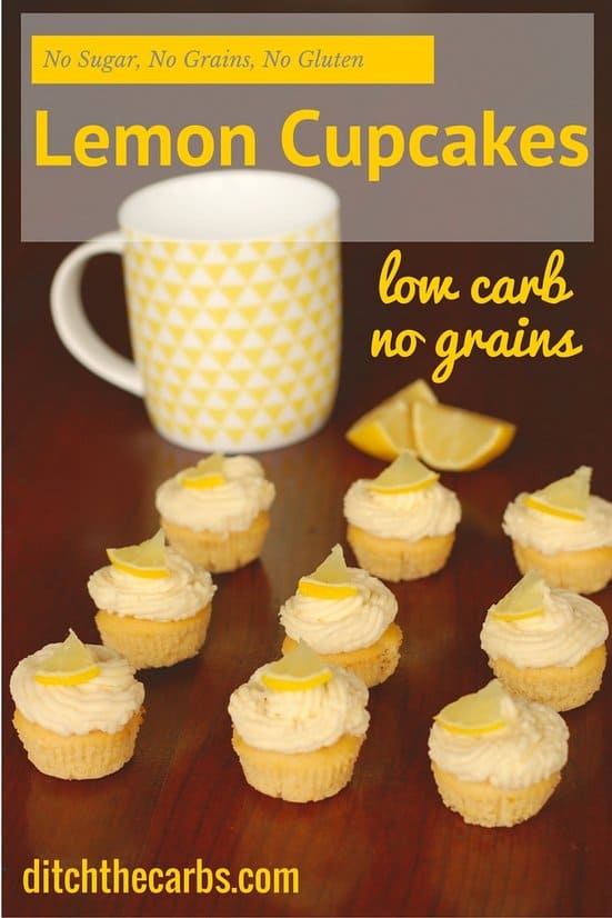 A yellow geometric mug with a dozen little low-carb lemon mini-cupcakes with sugar-free frosting and slices of lemon wedges