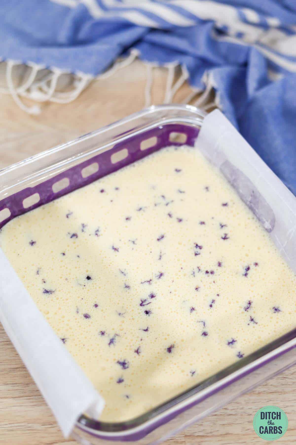fresh blueberries pressed into uncooked cheesecake filling before baking
