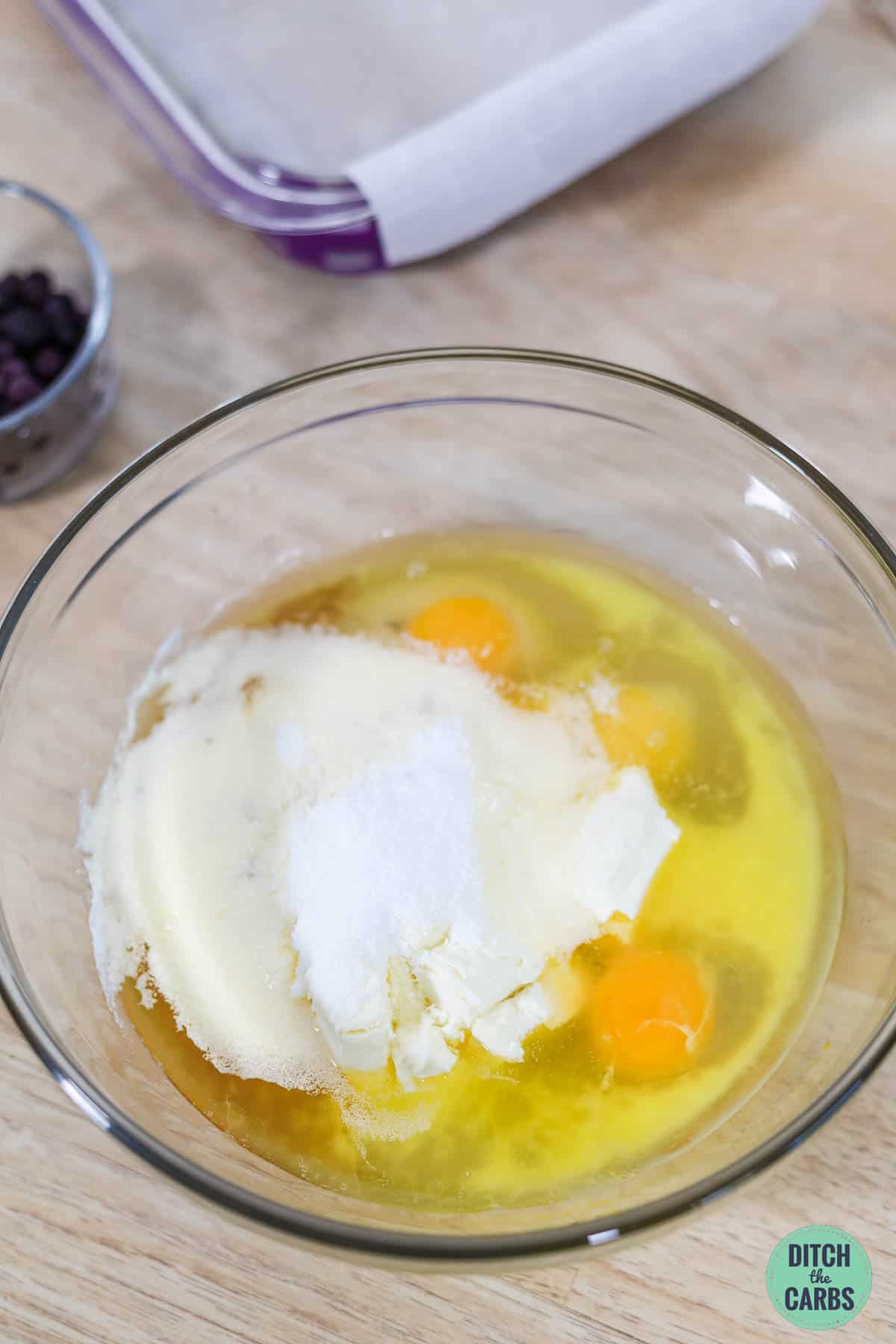 eggs, cream cheese and sweetener in a glass mixing bowl with a stick blender