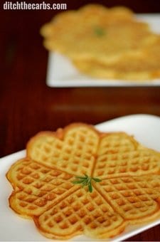 Low carb pizza waffles stacked on a plate