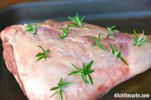 Close-up of roast lamb with fresh rosemary