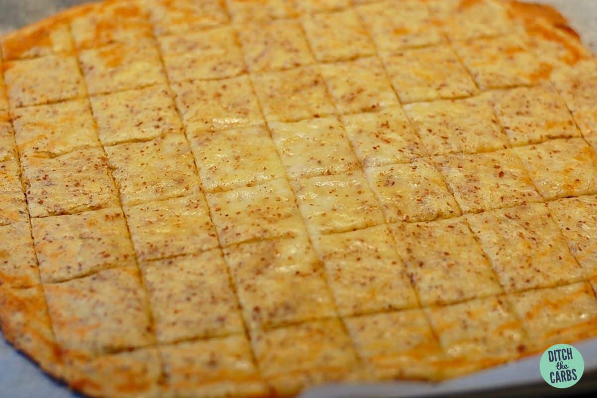 dough cut into squares on a baking sheet