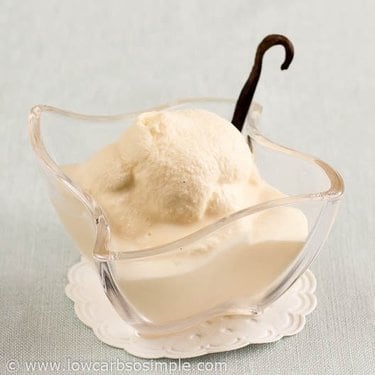 Freezer bag ice cream in a glass dish with a vanilla pod on the side