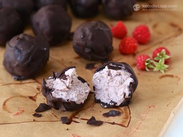 Blueberry cheesecake balls covered in chocolate and cut in half