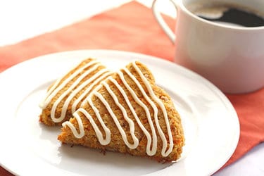 Cinnamon carrot scones drizzled with white frosting
