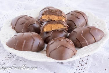 Sugar-free Easter peanut butter eggs on a plate and lace cloth