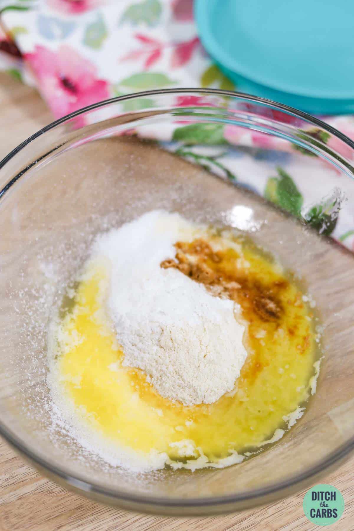melted butter and coconut flour in a mixing bowl
