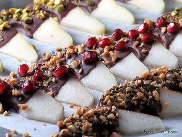 Chocolate dipped sliced pears with fruit chunks