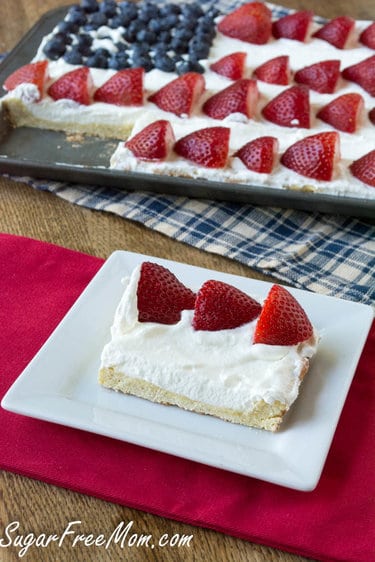 A slice of cheesecake on a table decorated for 4th July