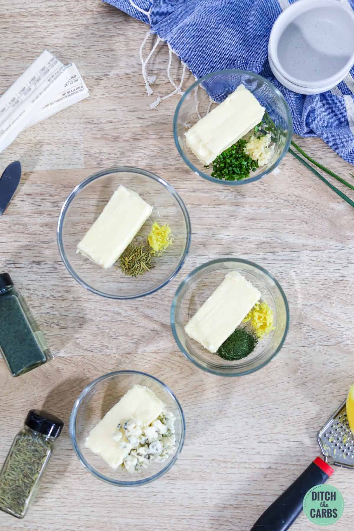 four pots of homemade herbed butter