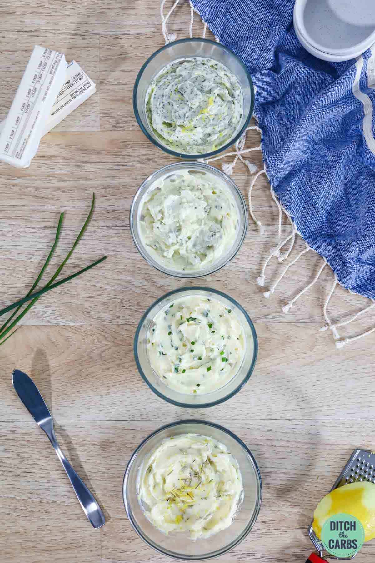four pots of homemade herbed butter