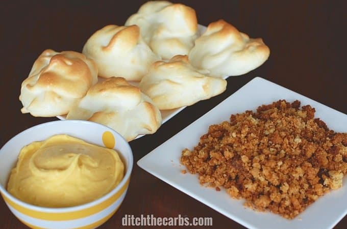 deconstructed low carb lemon meringue pies showing the 3 elements to make these mini desserts on a square white plate