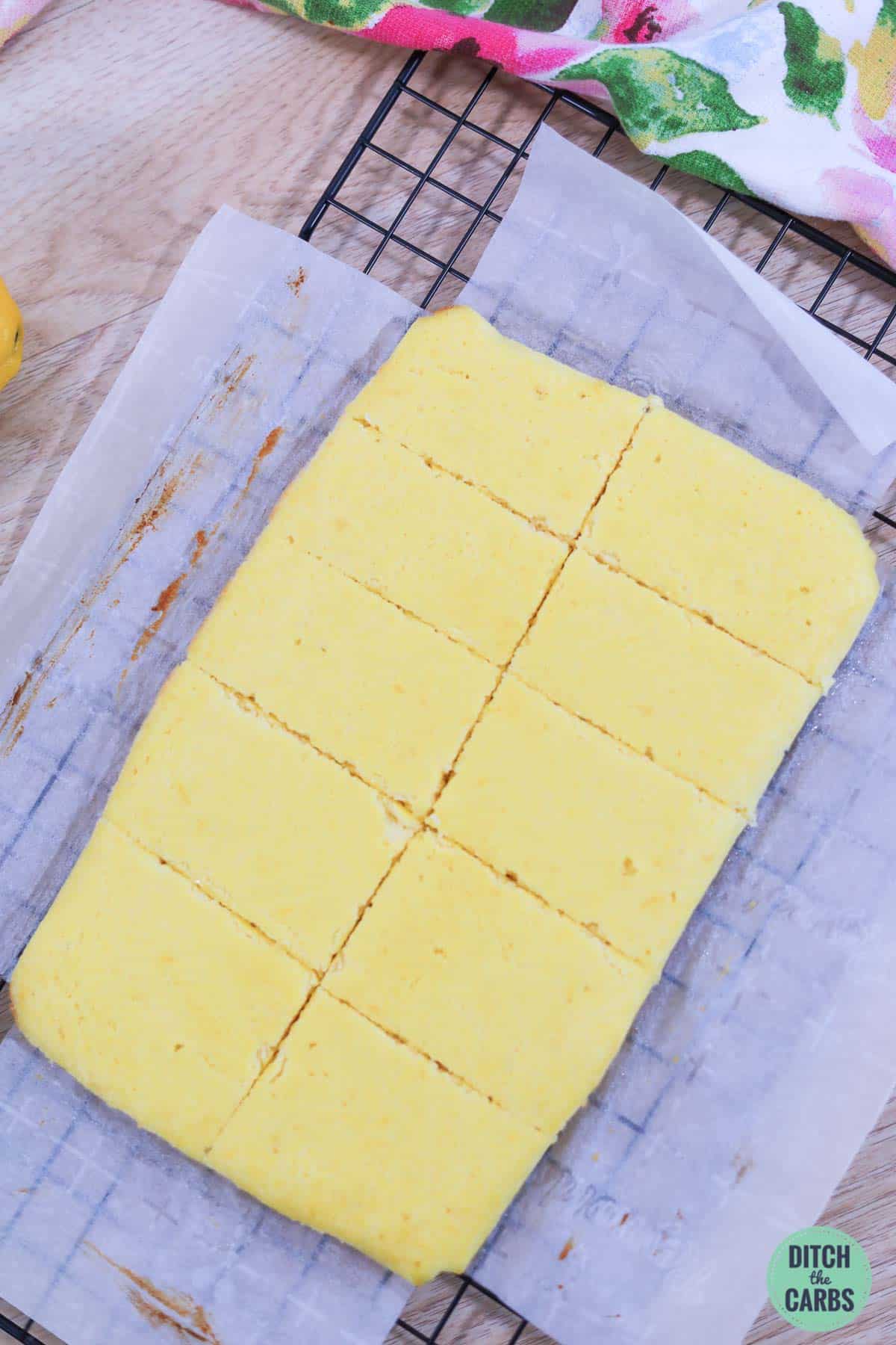 sliced keto lemon cake on baking paper